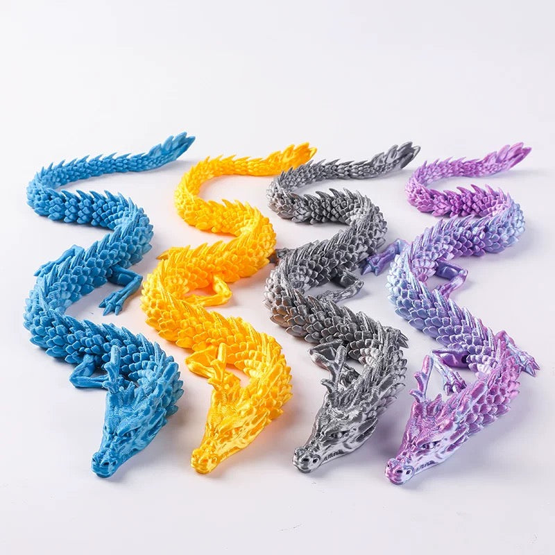 Colorful dragon-shaped figurines on a white background