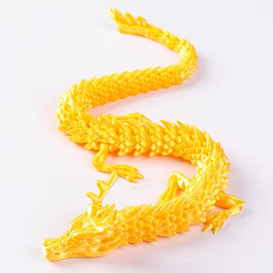 Yellow dragon toy on a white background.