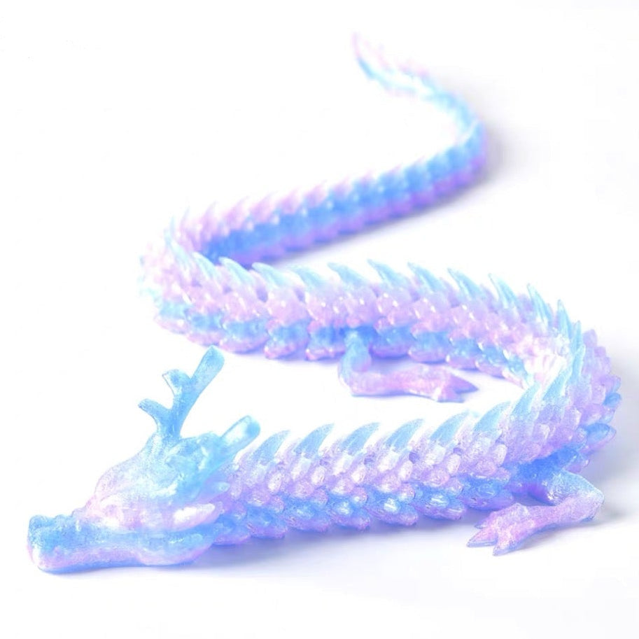 Colorful dragon toy on a white background.